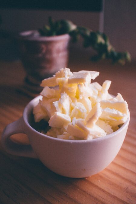 white ceramic mug with butter