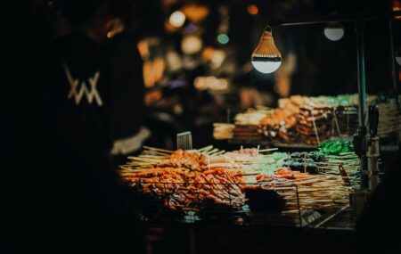 skewered meats on grill